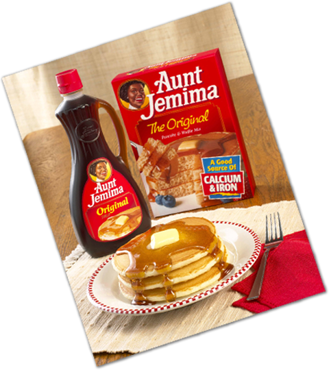 A box of Pearl Milling Company Pancakes and a plate of pancakes